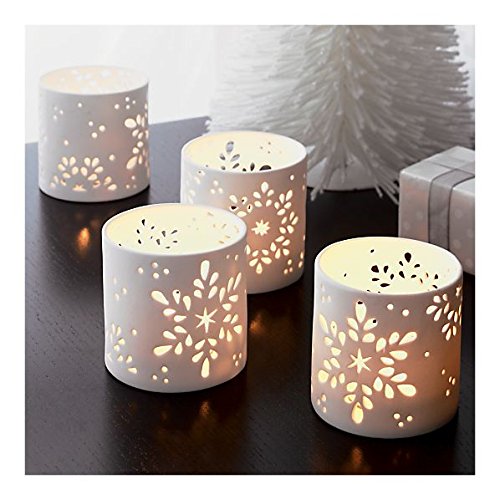 white ceramic tealights embellished with a lovely snowflake design, adding a touch of winter magic to any space.