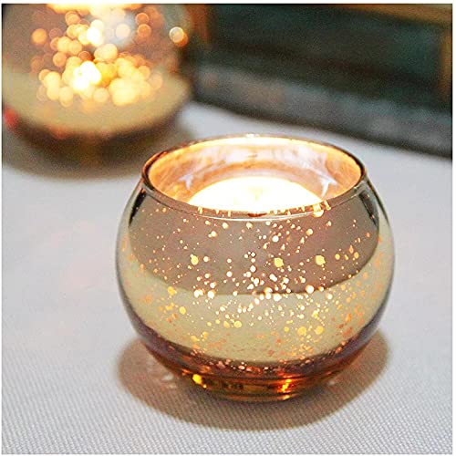 Golden glass tealights on marble tray, elegant home decor.