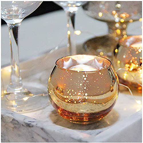 Stylish marble tray with golden glass tealights, modern home accent.