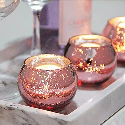 Two pink glass tealights on a tray, perfect for setting a relaxing mood
