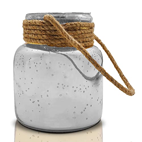 A glass jar with a piece of rope next to it.