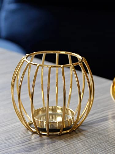 Elegant bird cage made of gold with a candle