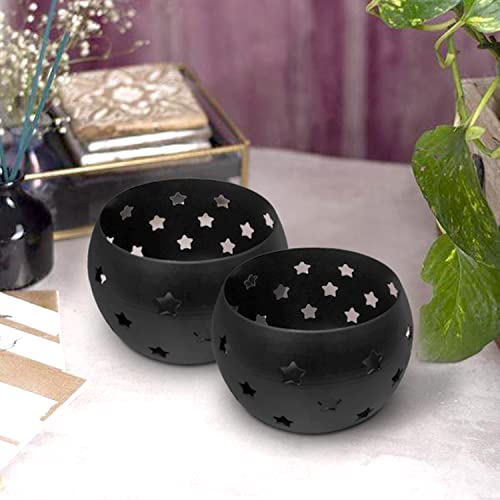 Pair of black bowls featuring star designs.