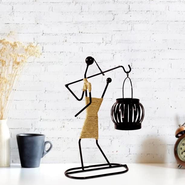 Intricately designed metal sculpture of woman with basket, artistic and graceful.