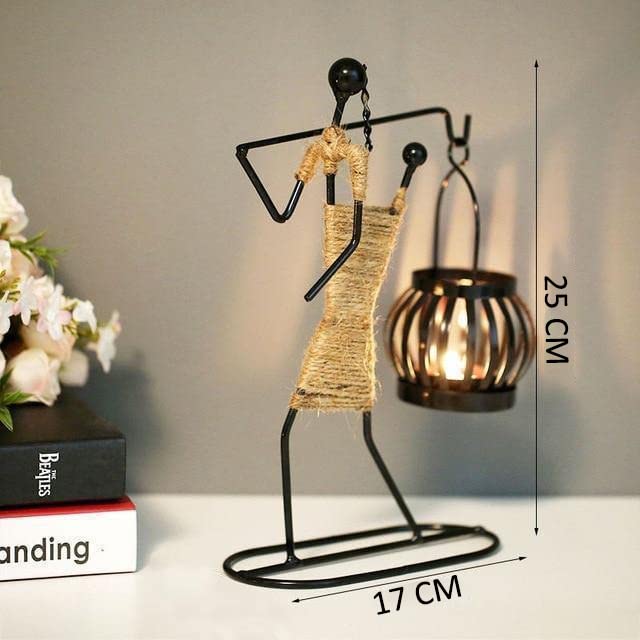 Artistic metal sculpture featuring woman holding basket, detailed craftsmanship, elegant pose.