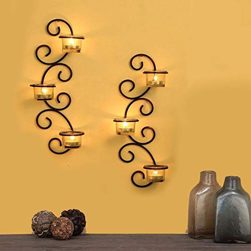 Decorative wall sconce holding candles.