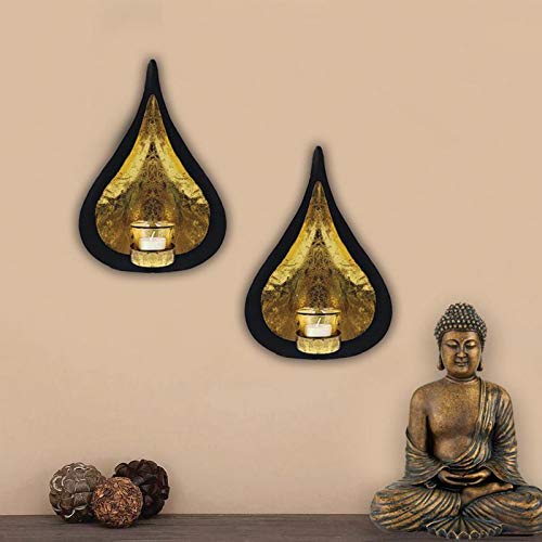 Stylish tear shaped wall sconces in gold and black metal finish.