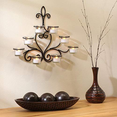Stylish candle holder on wall with candles and vases, perfect for relaxation.