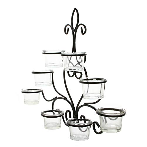 Wall mounted candle holder with candles and vases, creating a cozy atmosphere.