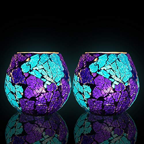 Two stunning glass vases in shades of purple and blue, embellished with beautiful designs.