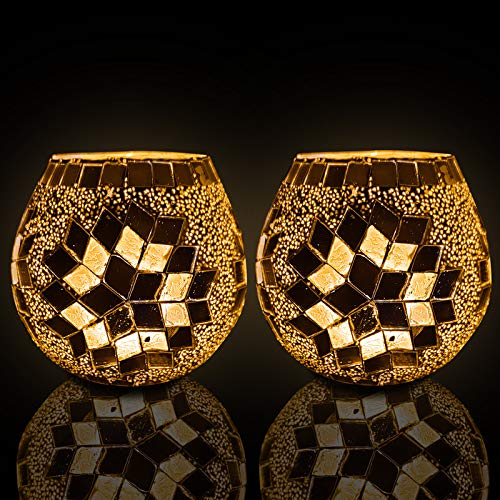  Glass candle holder with intricate gold mosaic detailing, a chic accent piece for any space.