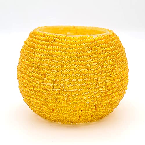  Bright yellow ball with beads on white