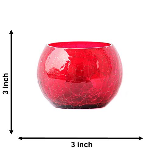 Glass bowl with lit red candle inside