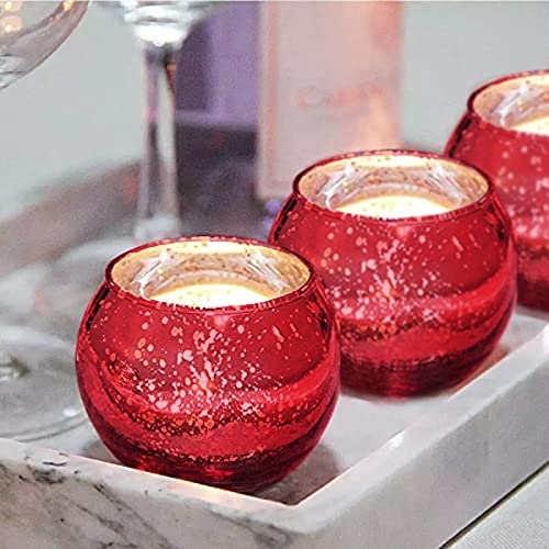 Trio of red glass tealights elegantly displayed on a tray.