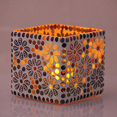 Vibrant pattern on small white candle holder.