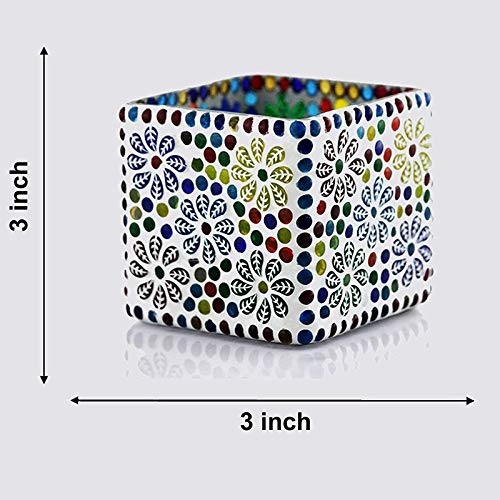 A colorful design on a square glass candle holder.