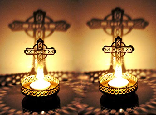 Gold cross shaped candle holders featuring intricate cross design, great for worship.