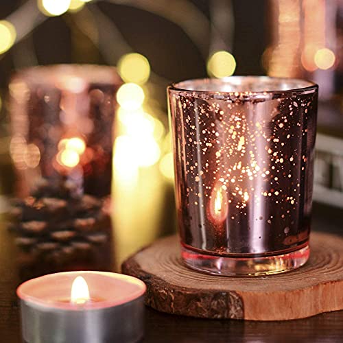 Candle and smaller candle on a wooden plate.