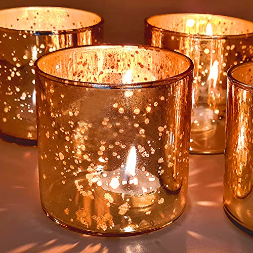 Decorative tealight holders in gold with star designs, ideal for creating a cozy ambiance.