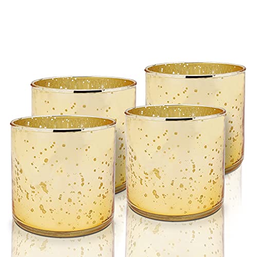 Shiny gold tea lights on a white background.