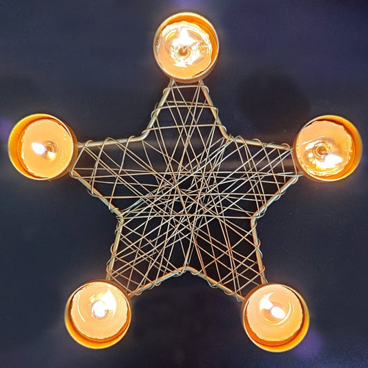  Candle holder shaped like a star with five candles.