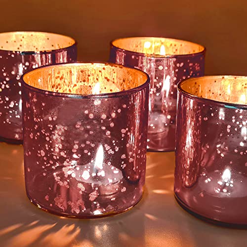 Four purple glass votives with elegant gold accents, perfect for adding a touch of sophistication to any space.