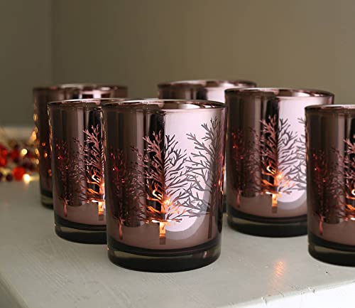 Six glass votive candles with a silver design.