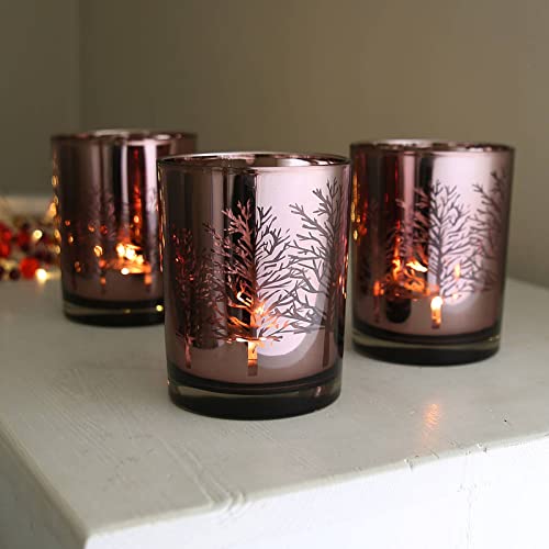 Six glass votive candles with a silver design, perfect for adding a touch of elegance to any room.