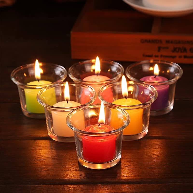 Table setting with six votive glass candles