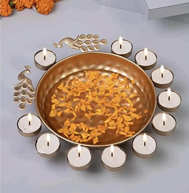A gold plate adorned with delicate flowers and flickering candles.