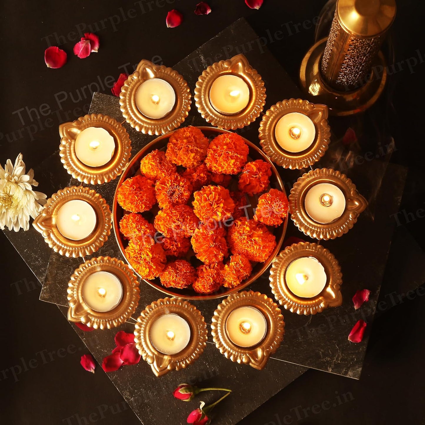 An elegant arrangement of flowers and candles in a small bowl, perfect for adding a touch of beauty to any space.