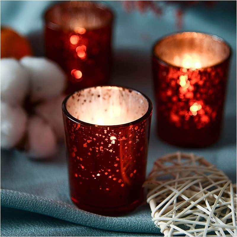 Wooden table adorned with red tea lights.