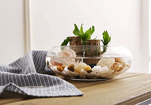 Glass bowl holding a candle with rocks and stones.