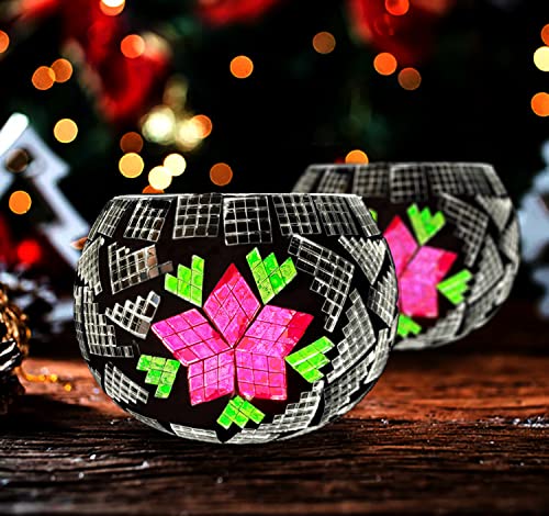 Two glass bowls with pink and green designs, one with floral patterns and the other with geometric shapes.