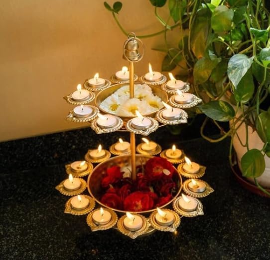 Opulent cake featuring gold and white decor on three tiers.