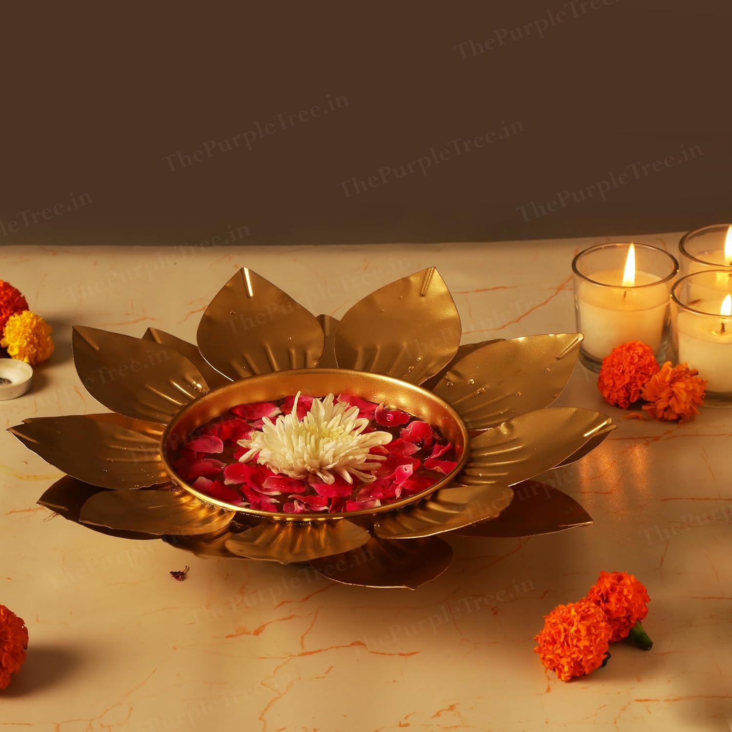 Shiny flower diya with burning candles, representing hope and joy in traditional ceremonies.