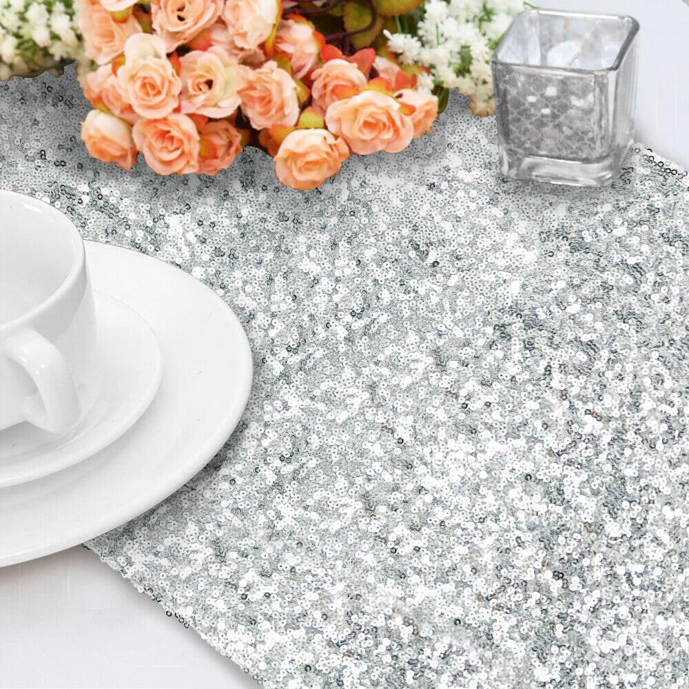 Sparkling silver sequin table runner with charming floral details.