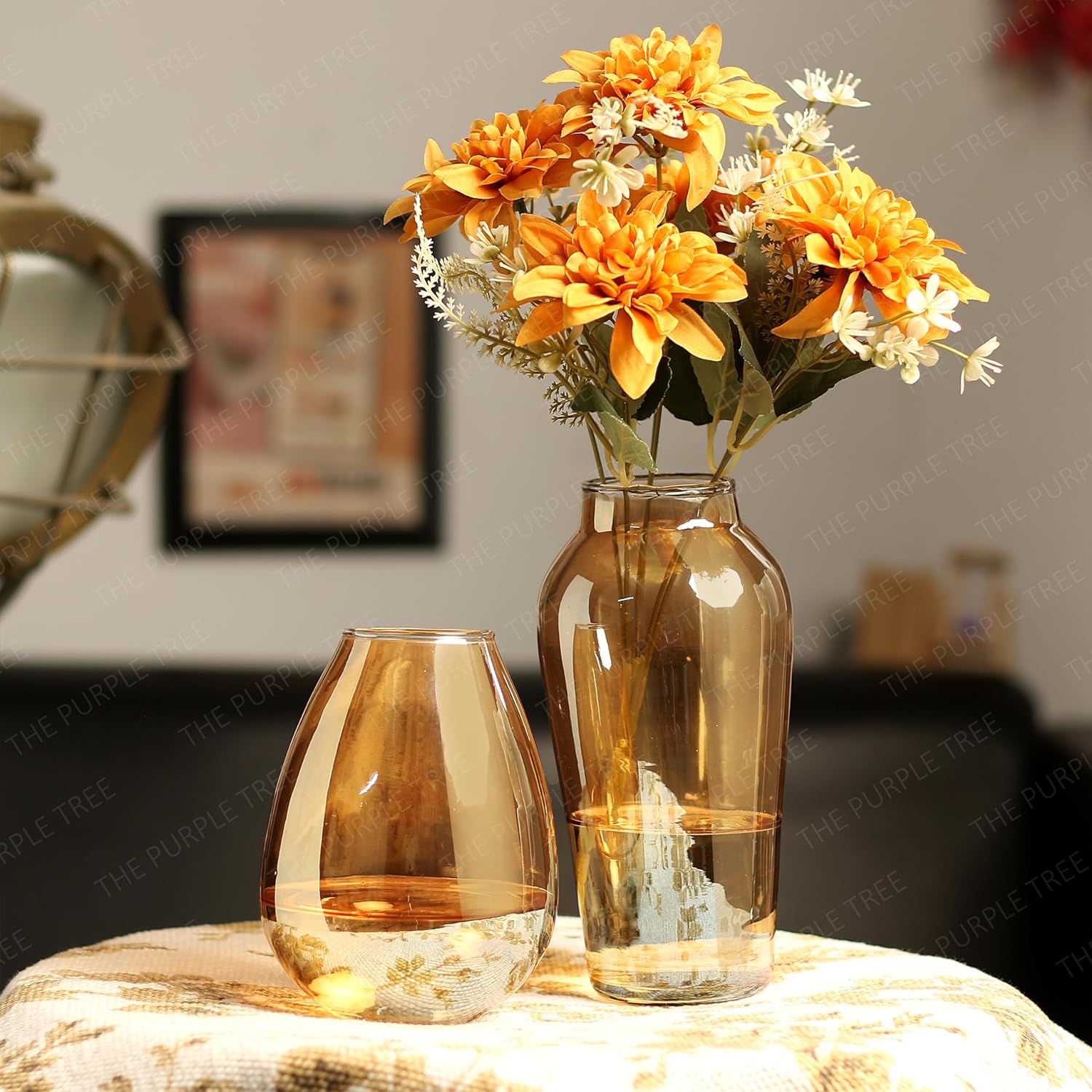 Colorful flowers in vases placed on a table.