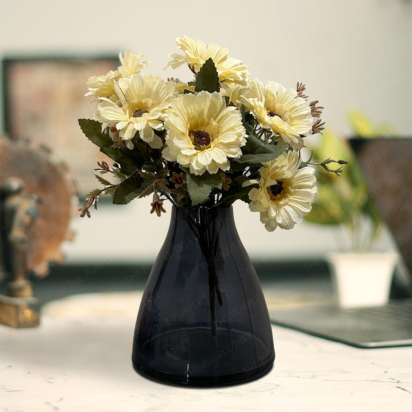 A decorative vase filled with colorful flowers placed elegantly on a wooden table.