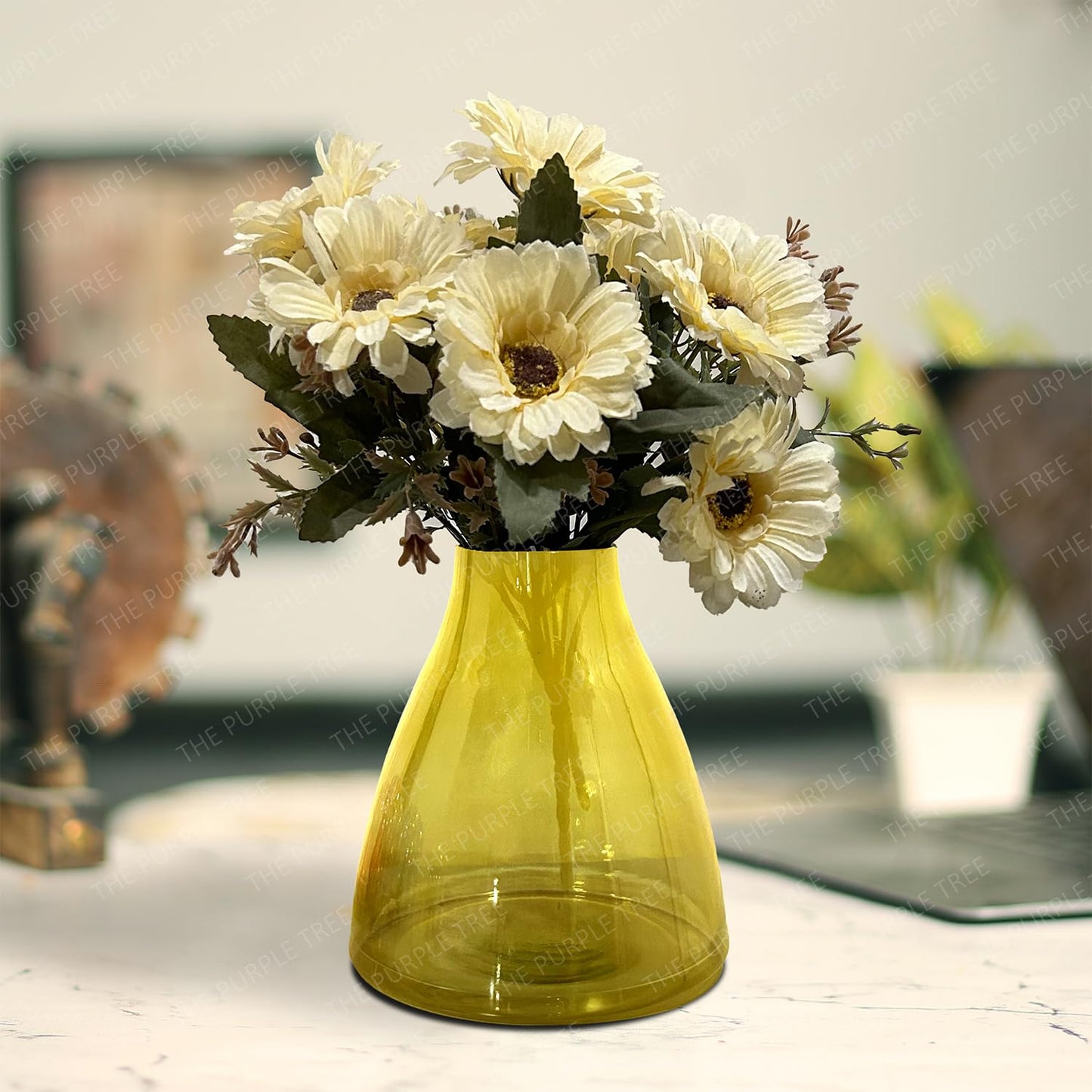 A yellow vase filled with delicate white flowers, creating a bright and cheerful centerpiece.