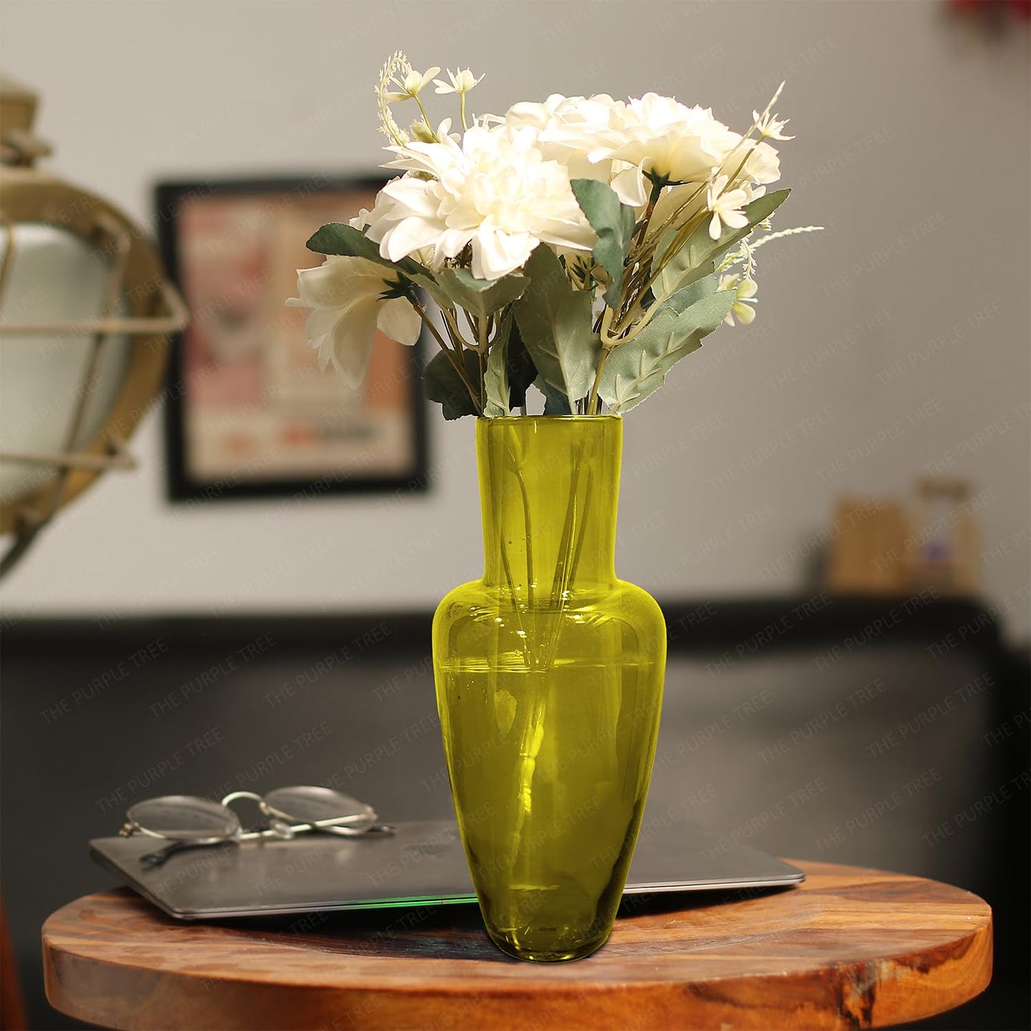 A yellow vase featuring a small hole in the center, showcasing a simple yet elegant design.